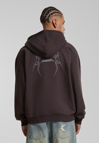 Veste de survêtement Karl Kani en marron : devant