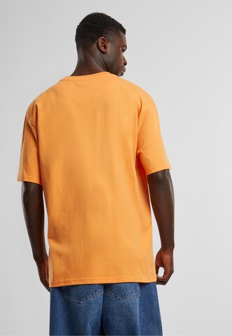 Karl Kani - Camisa 'Essential' em laranja
