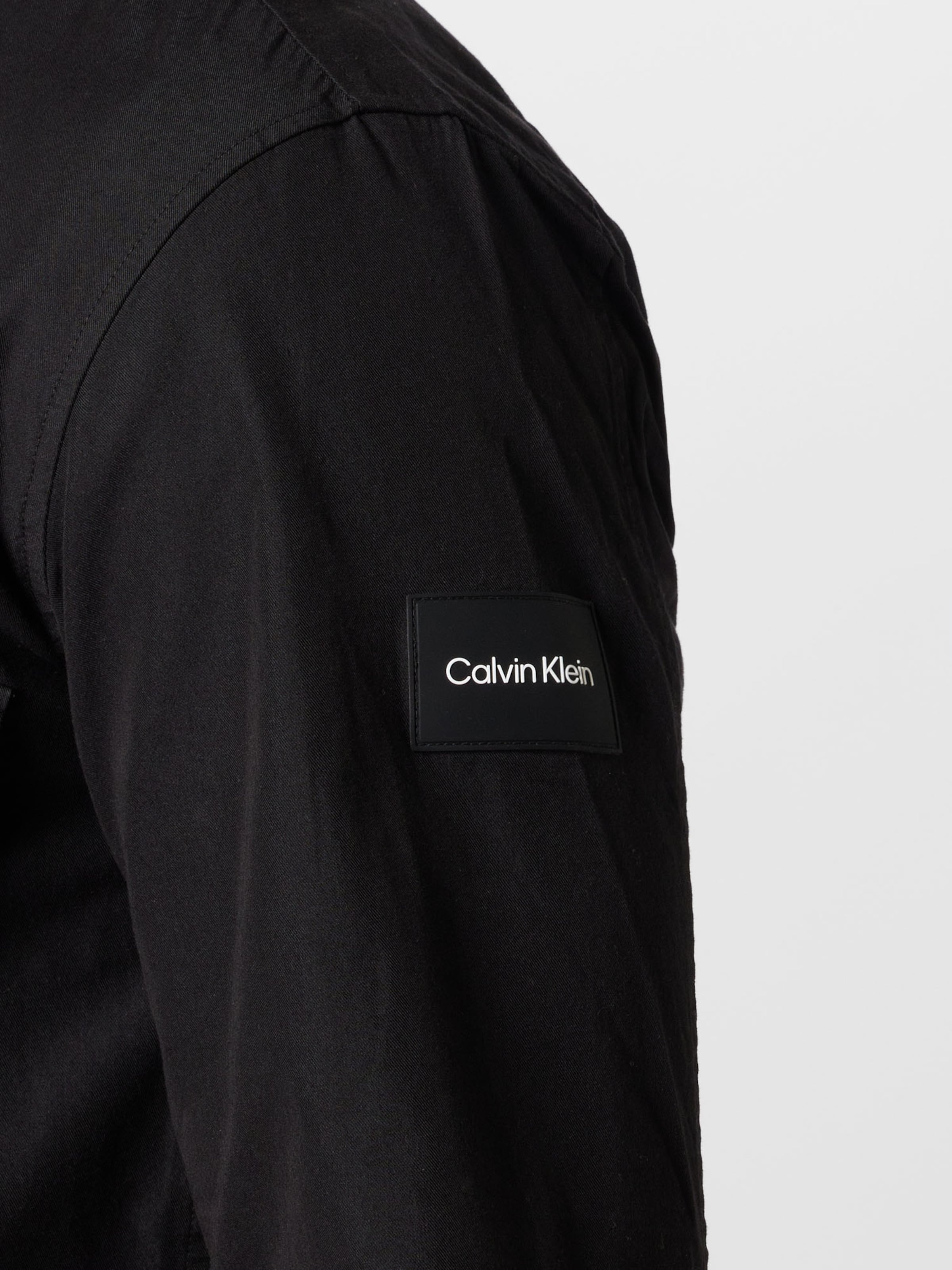 Calvin Klein Between Season Jacket in Black ABOUT YOU