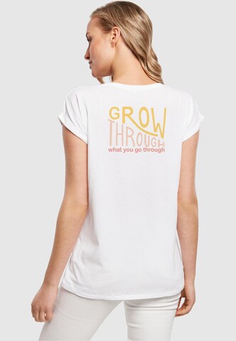 T-shirt 'Spring - Grow through' Merchcode en blanc
