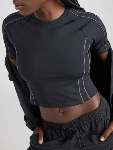 NIKE Funktionstopp 'One' i svart