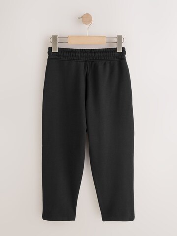 juoda Next Siaurėjantis Kelnės