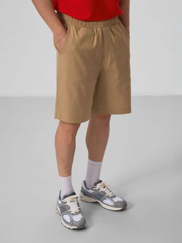Regular Pantalon chino Tommy Life en marron