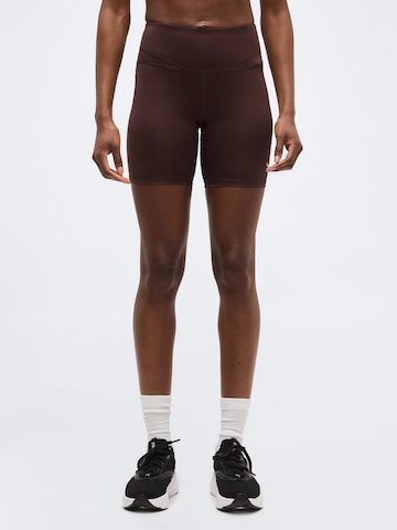 Skinny Pantaloni sport 'PWRSHAPE SUNDAY BLISS' de la PUMA pe maro: față