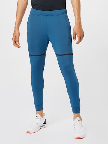 Effilé Pantalon de sport OAKLEY en bleu : devant