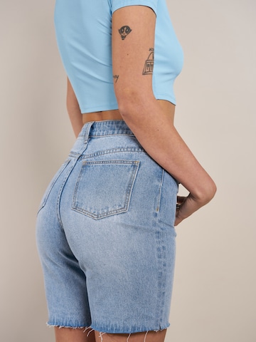 ABOUT YOU x Laura Giurcanu Slimfit Jeans 'Viola' in Blauw