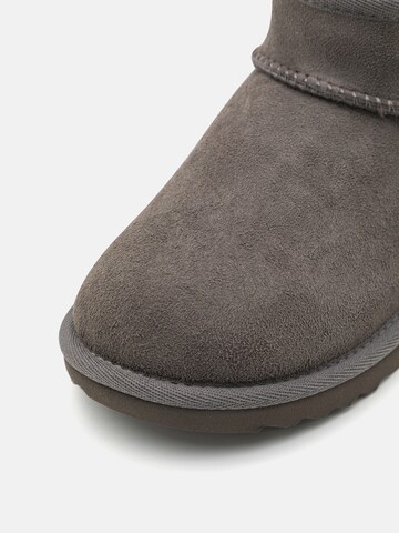 Bocanci de zăpadă 'CLASSIC ULTRA MINI' de la UGG pe gri