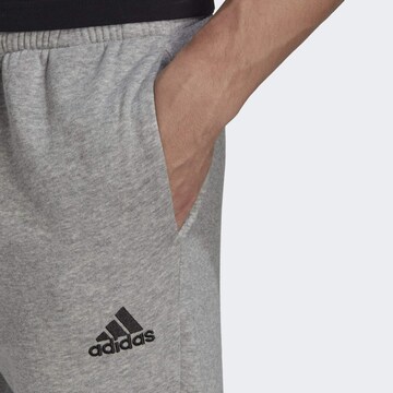 ADIDAS SPORTSWEAR Tapered Workout Pants 'Essentials' in Grey