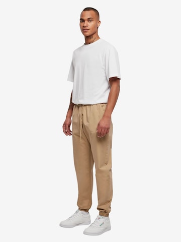 Urban Classics Tapered Housut värissä beige