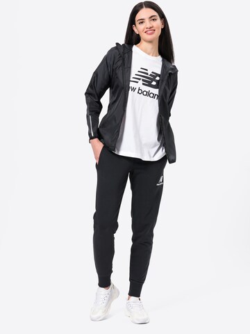 Tapered Pantaloni 'Essentials' de la new balance pe negru