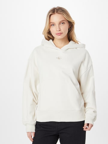 Sweat-shirt Calvin Klein Jeans en beige : devant