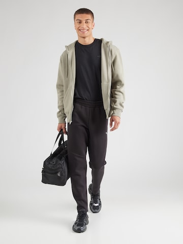 PUMA Regular Sportbroek 'EVOSTRIPE' in Zwart