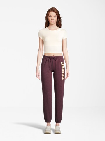 AÉROPOSTALE Tapered Trousers in Red