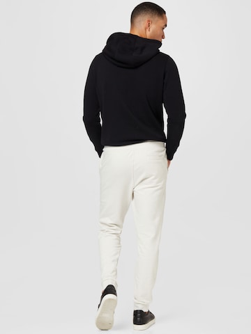 GUESS - Tapered Pantalón 'ADAM' en blanco