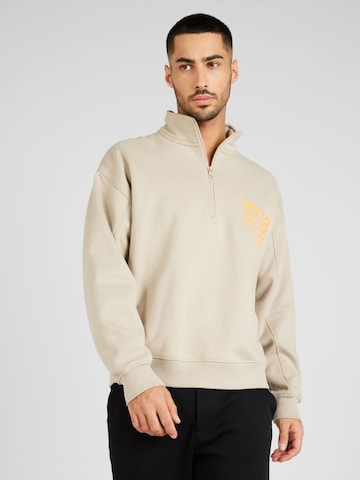 Sweat-shirt Calvin Klein Jeans en beige : devant