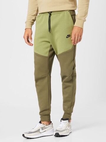 Nike Sportswear Tapered Pants in Green: front