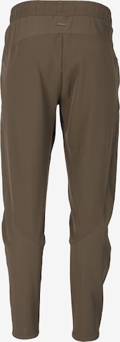 Athlecia Regular Workout Pants 'Timmie' in Brown