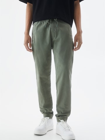 Pull&Bear Zwężany krój Spodnie w kolorze zielony: przód