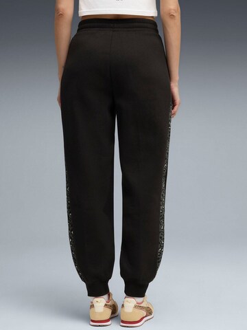 PUMA - Tapered Pantalón deportivo 'Puma Ess Graphic Animal Comfort High-waist Sweatpants' en negro