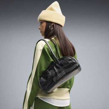 PUMA Schultertasche '1976' in Schwarz