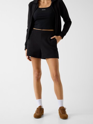 GUESS Regular Pants in Black: front
