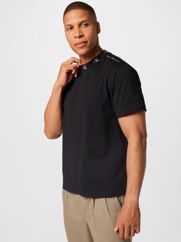 Tricou de la Calvin Klein Jeans pe negru: față