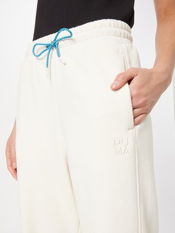 PUMA - Tapered Pantalón deportivo 'Infuse' en blanco