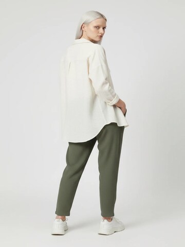 No Matter What Tapered Pleat-front trousers in Green