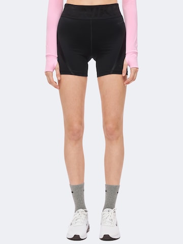 Skinny Pantalon de sport NIKE en noir : devant