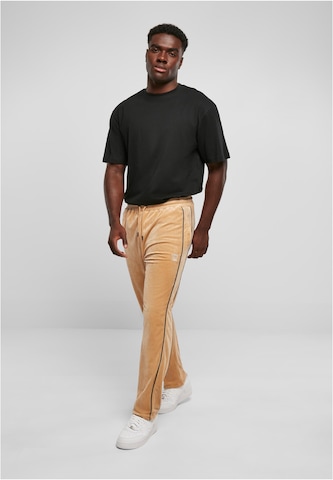 Karl Kani Regular Trousers in Beige