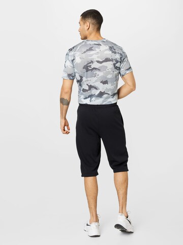 NIKE Loosefit Sportbroek in Zwart