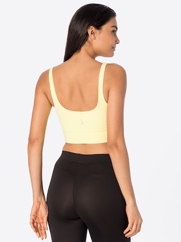 NIKE Regular Sports Bra in Yellow