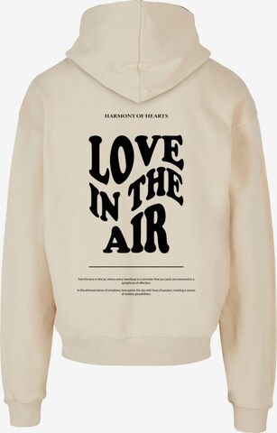 Sweat-shirt ' Love In The Air' Merchcode en beige