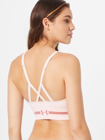 Bustier Soutien-gorge de sport 'Seamless' UNDER ARMOUR en rose