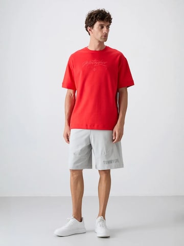 Maglietta di Tommy Life in rosso