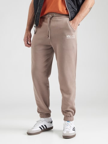 ALPHA INDUSTRIES Ozke Hlače | rjava barva: sprednja stran