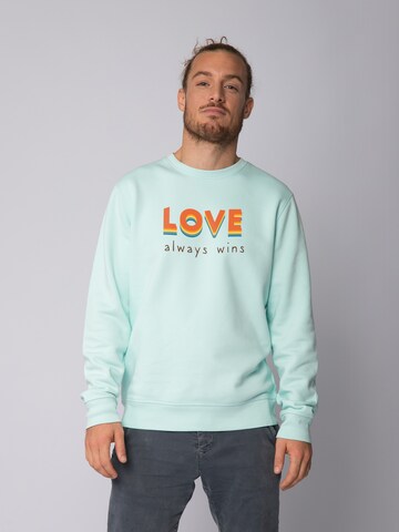 Watapparel Sweatshirt ' Love always wins ' in Blauw: voorkant