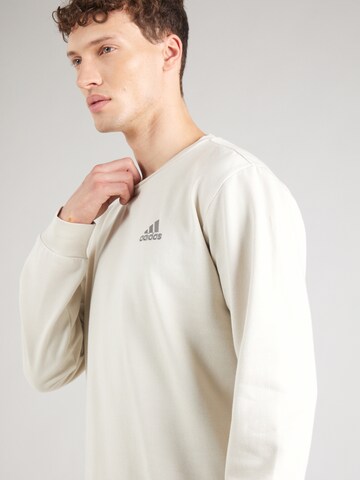 ADIDAS SPORTSWEAR Sports sweatshirt 'FEELCOZY' in Beige
