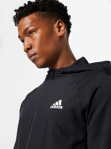 juoda ADIDAS SPORTSWEAR Sportinė striukė