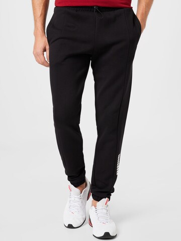 Effilé Pantalon de sport PUMA en noir : devant