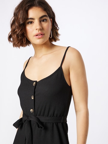 Tuta jumpsuit 'Polly' di ABOUT YOU in nero