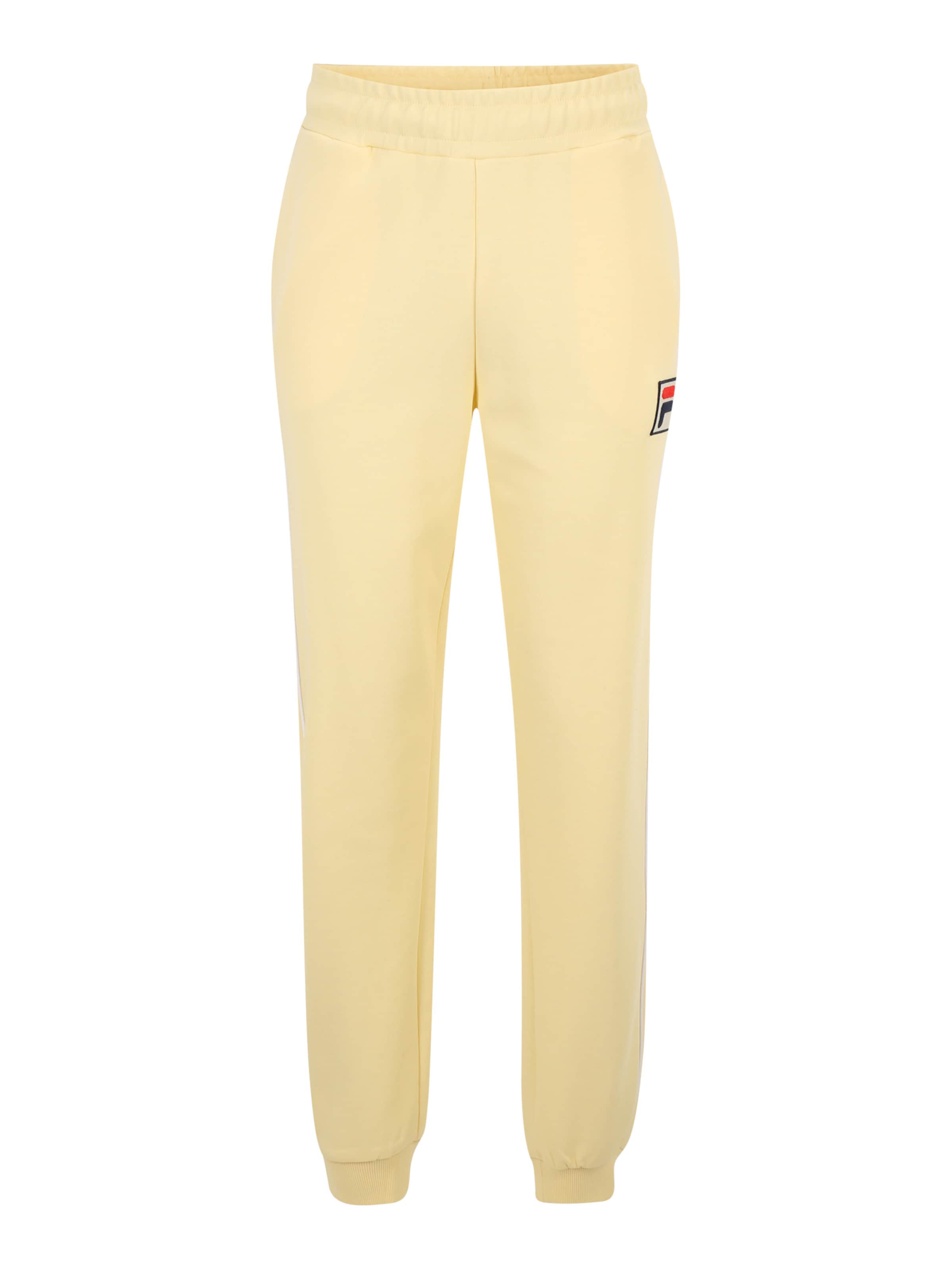 FILA Regular Pants LINCOLN in Yellow ABOUT YOU