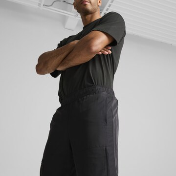 PUMA Tapered Sportbroek in Zwart