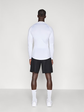 NIKE Loosefit Παντελόνι φόρμας 'FLEX' σε μαύρο