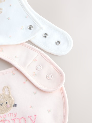 Next Ruokalappu värissä vaaleanpunainen