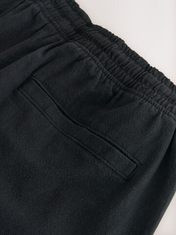 Next Loosefit Shorts in Schwarz