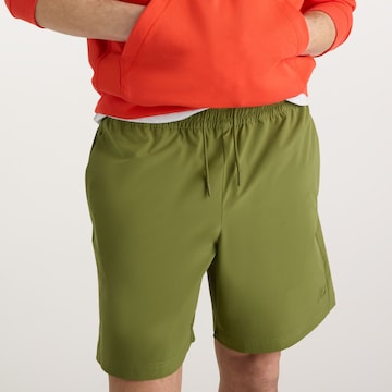 new balance - Loosefit Pantalón 'Athletics Stretch Woven Short 7"' en verde