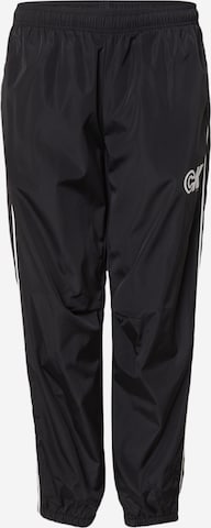 Calvin Klein Jeans Tapered Housut värissä musta: etupuoli