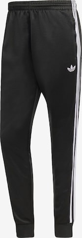 ADIDAS ORIGINALS Trousers 'SST' in Black: front