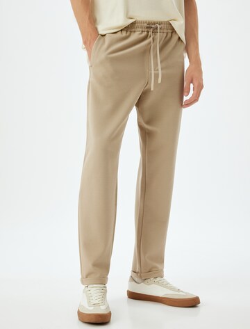 Koton Loose fit Trousers in Beige: front